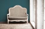 White textile classical style sofa in vintage room. White old ba